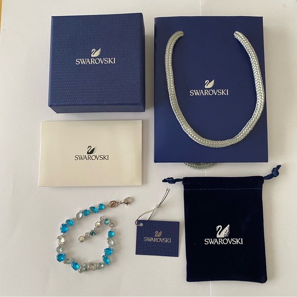 Swarovski Jewelry - New in Box $249 Swarovski Gema Blue Clear Color Crystals Silver Tone Bracelet